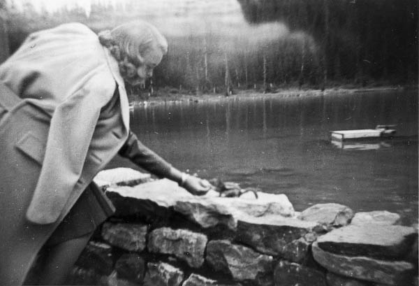 Jean Kellogg feeds a Chipmonk at Lake Louise